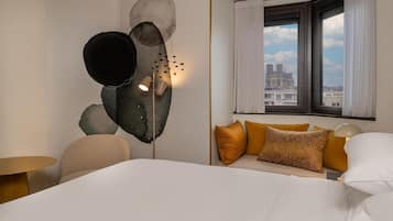 Luxe beddengoed, een minibar, een kluis op de kamer