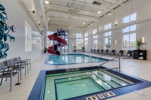 Indoor pool, open 8:00 AM to 11:00 PM, pool loungers