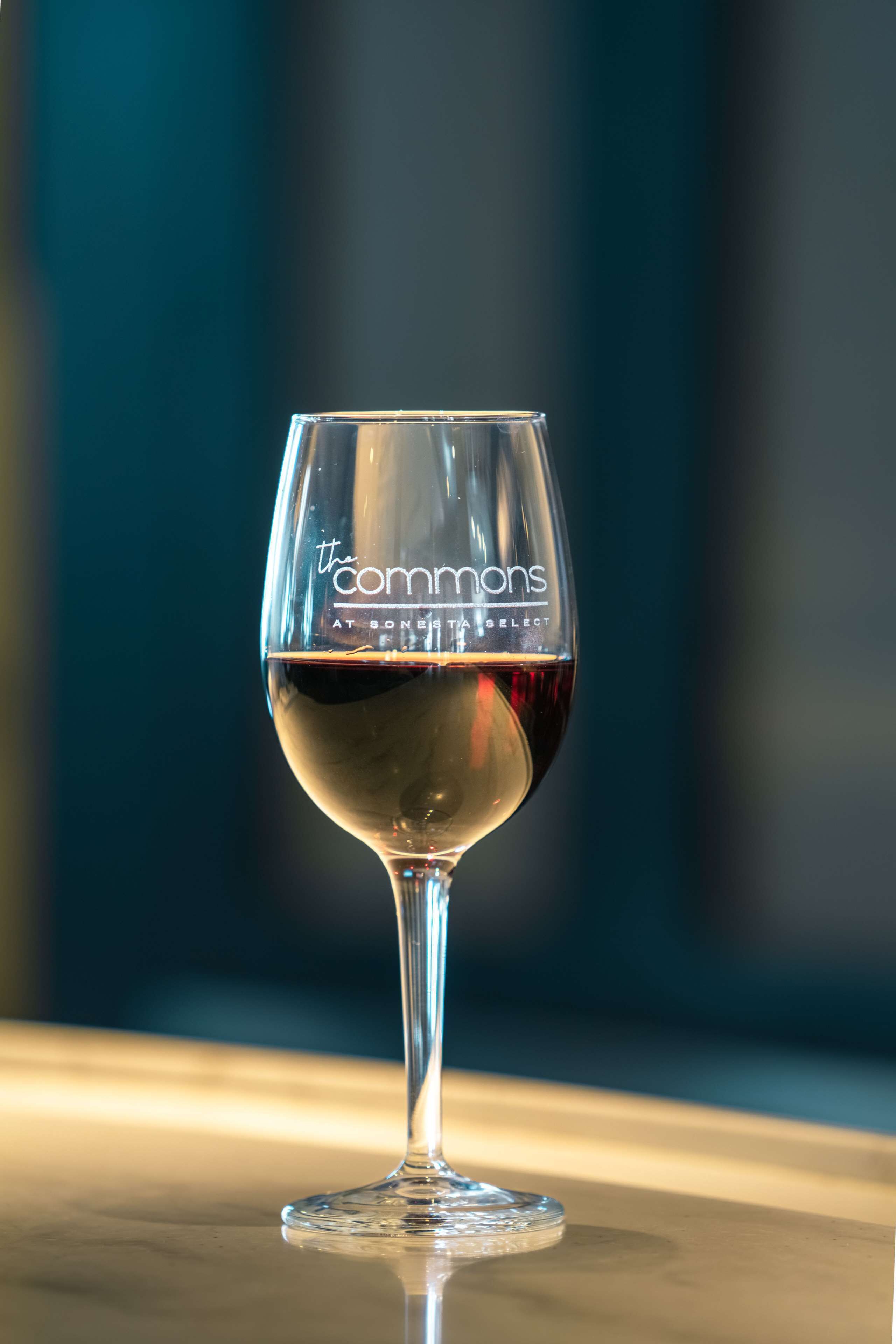 A wine glass with a label on it.