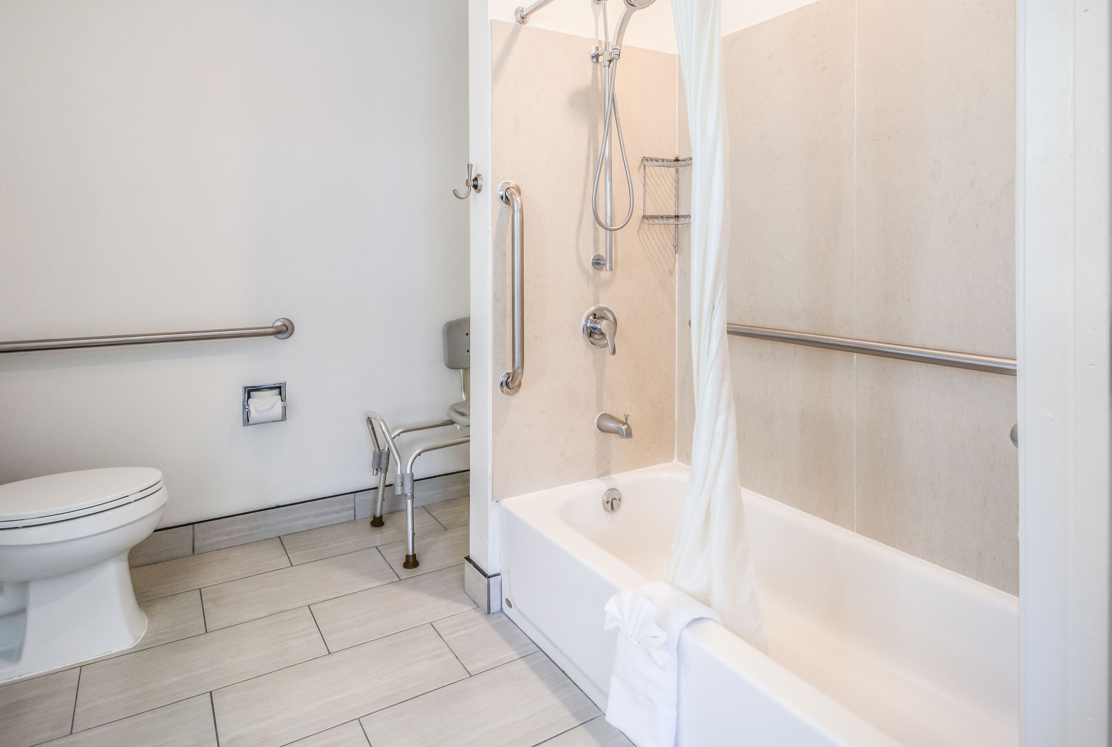 room, 1 queen bed, mobility accessible | bathroom | combined shower/bathtub, eco-friendly toiletries, hair dryer, towels