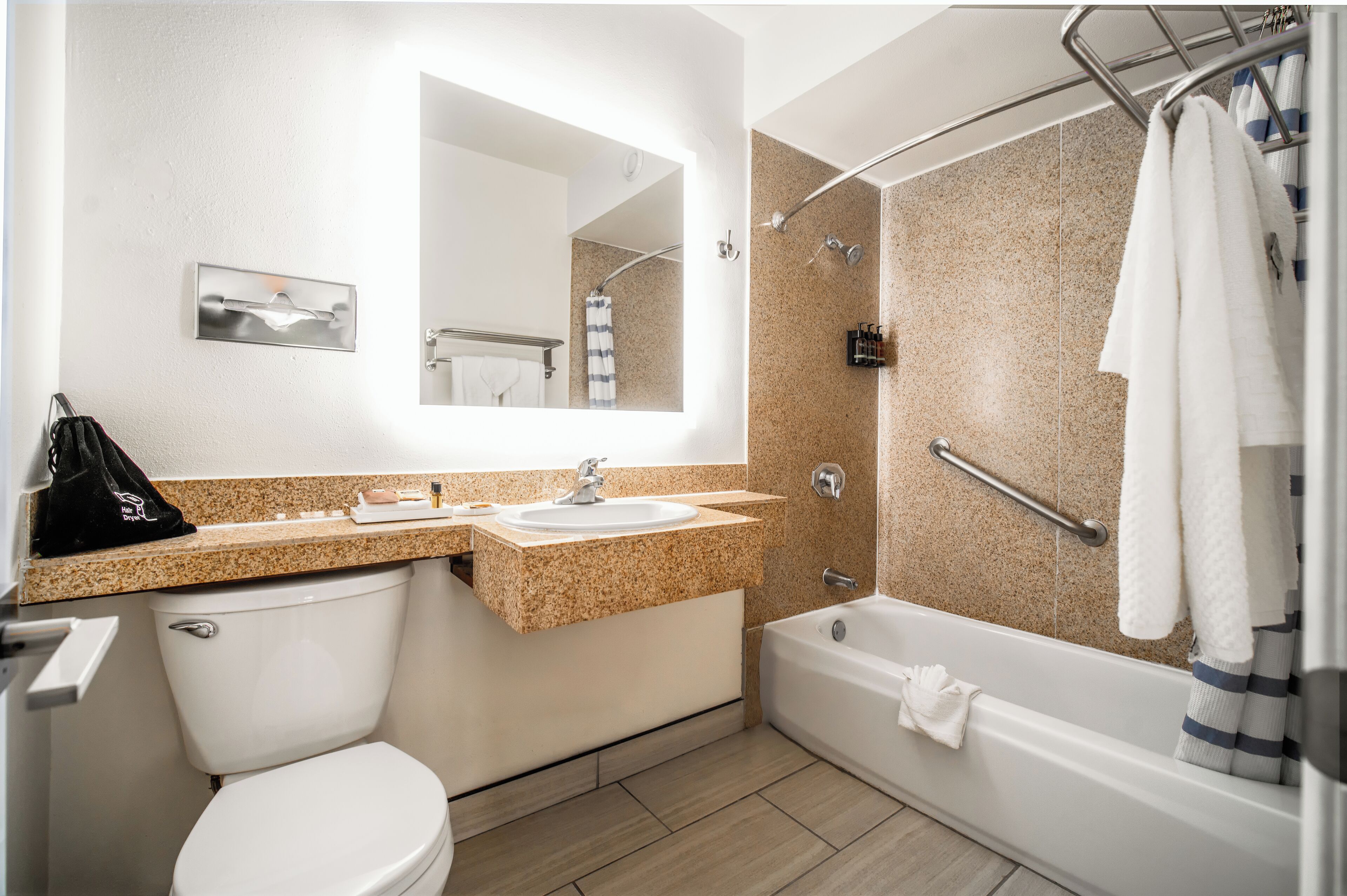room, 1 queen bed | bathroom | combined shower/bathtub, eco-friendly toiletries, hair dryer, towels