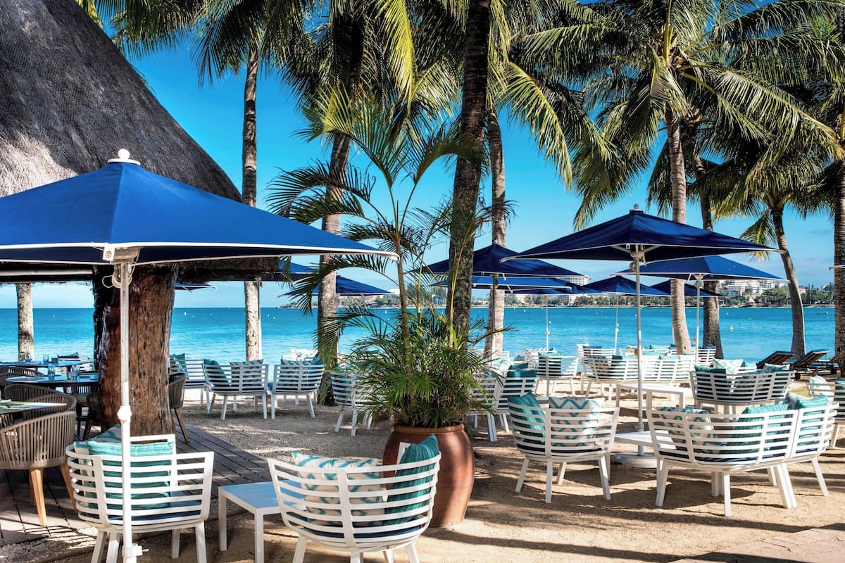 on the beach, sun-loungers, beach umbrellas, beach towels