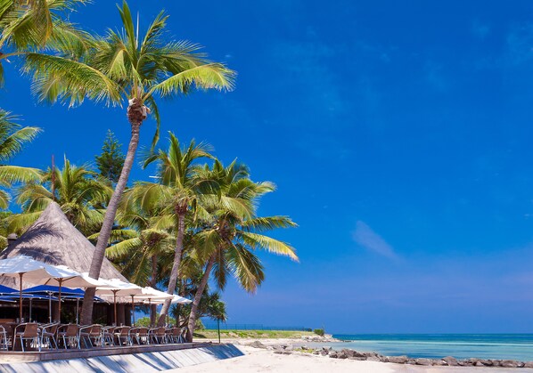 On the beach, sun loungers, beach umbrellas, beach towels