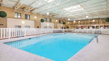 Indoor pool, open 8:00 AM to 11:00 PM, pool umbrellas