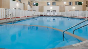 Indoor pool, open 8:00 AM to 11:00 PM, pool umbrellas