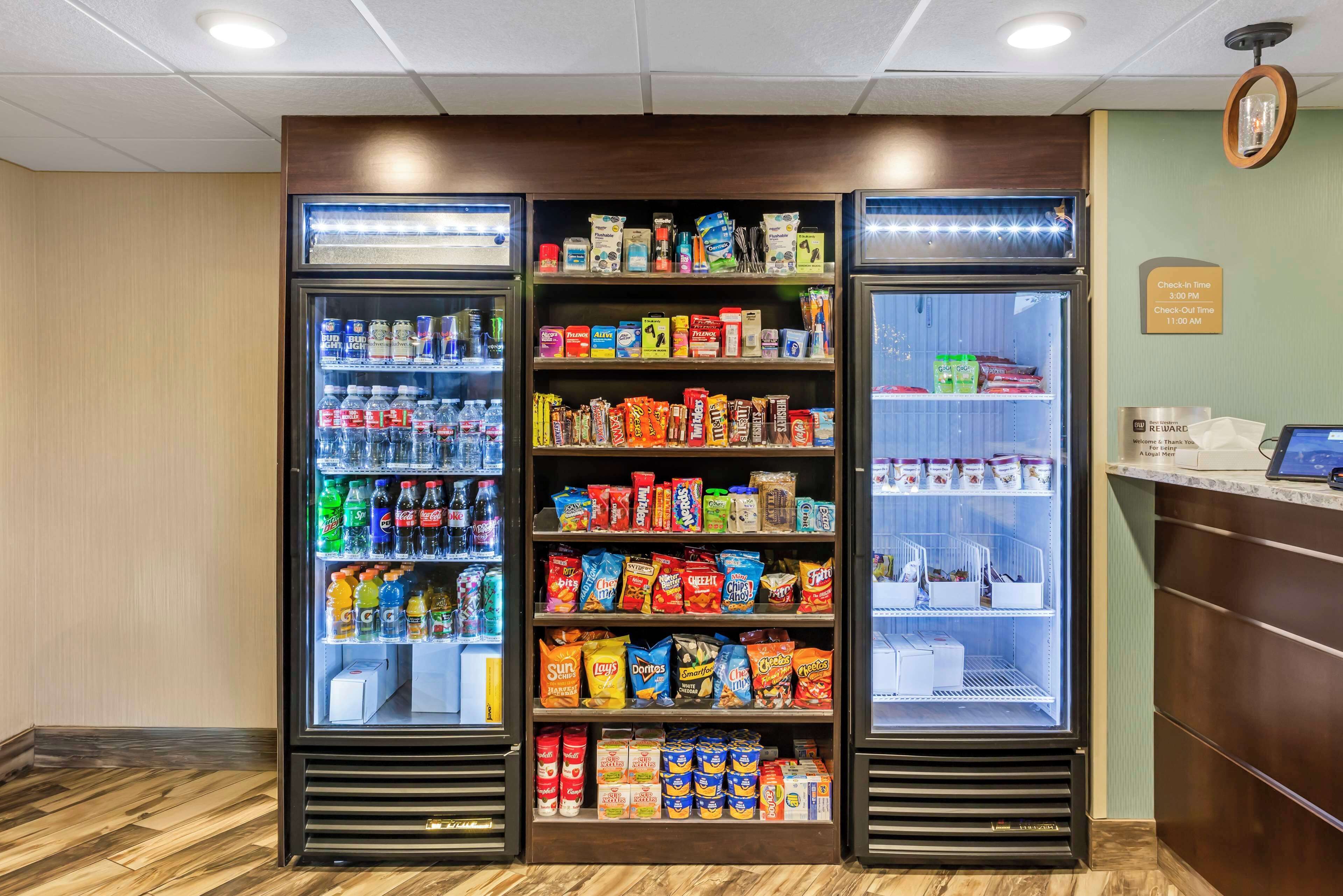 A vending machine area with various snacks and drinks.