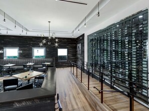 A modern restaurant with a wine cellar. - DoubleTree by Hilton Hotel Wichita Airport (Wichita)