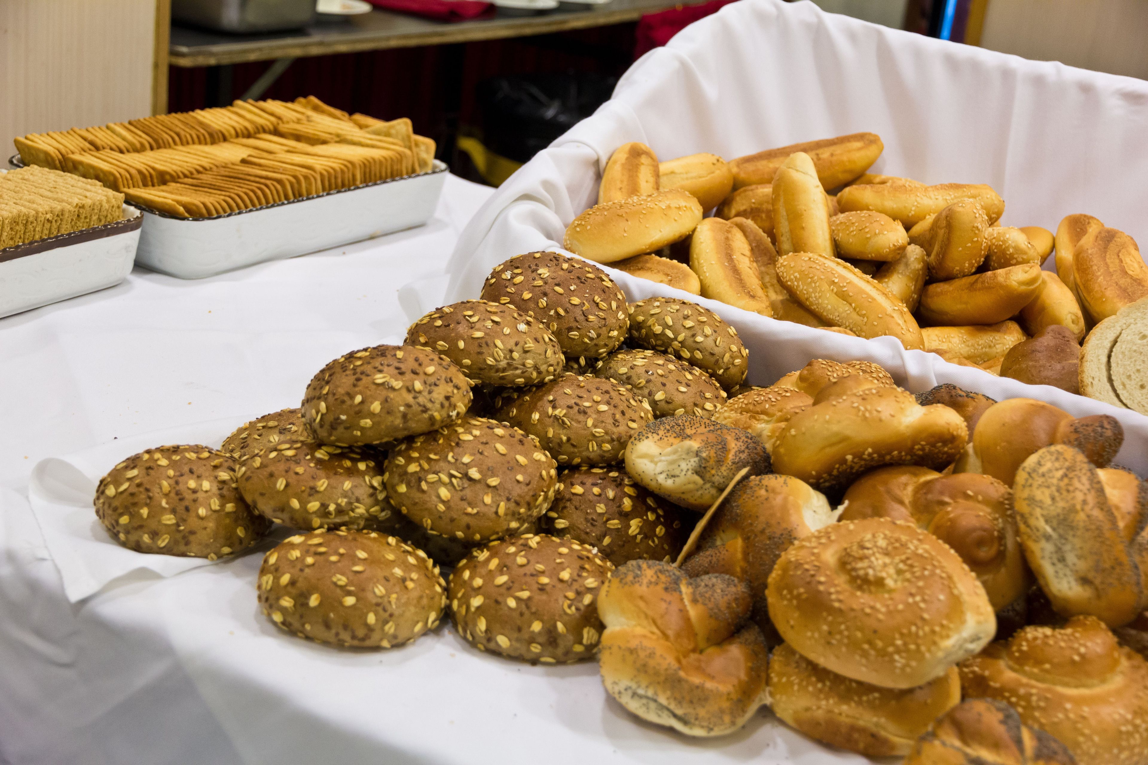 A variety of baked goods displayed on a table.