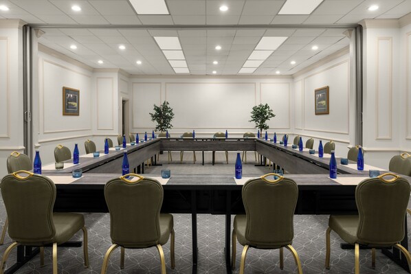 A conference room with a long table, chairs, and water bottles. - Saddlebrook Resort (Wesley Chapel)