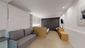 Quadruple Room, 1 Bedroom, Partial Ocean View | Hypo-allergenic bedding, in-room safe, desk, blackout drapes