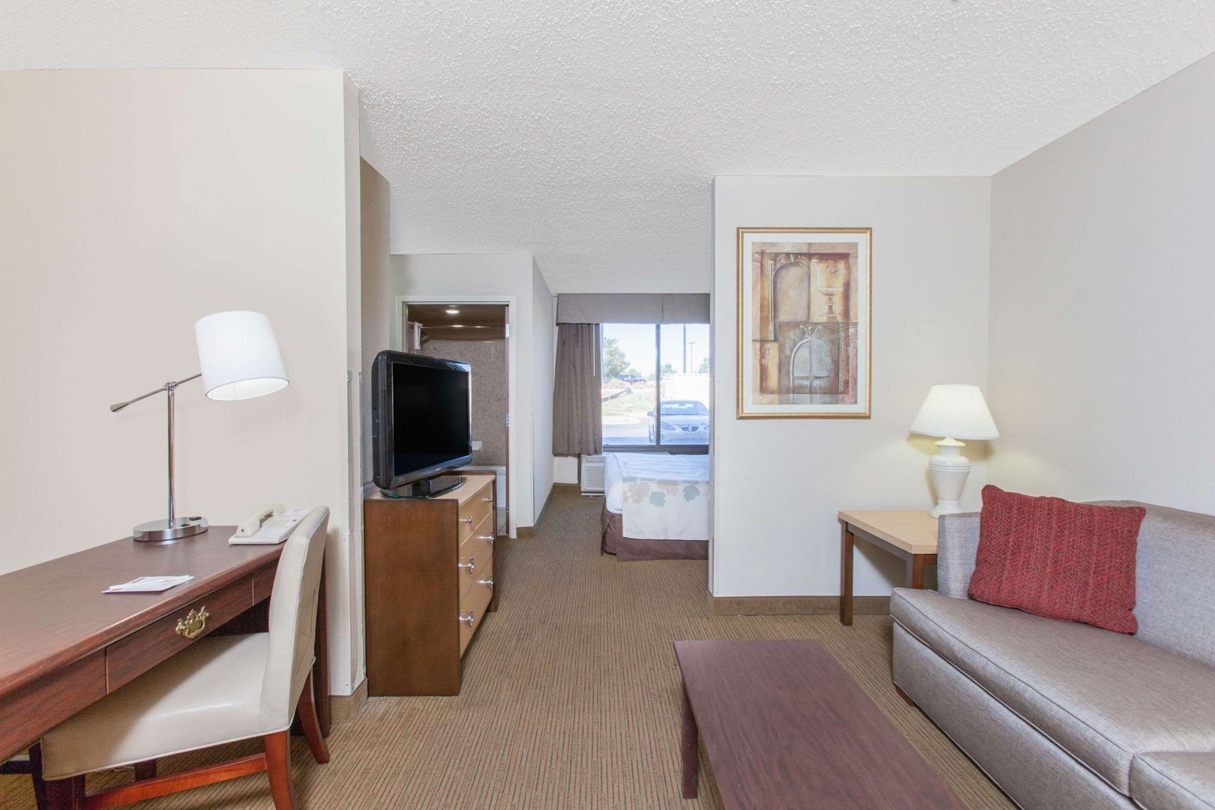 Premium bedding, desk, laptop workspace, blackout curtains