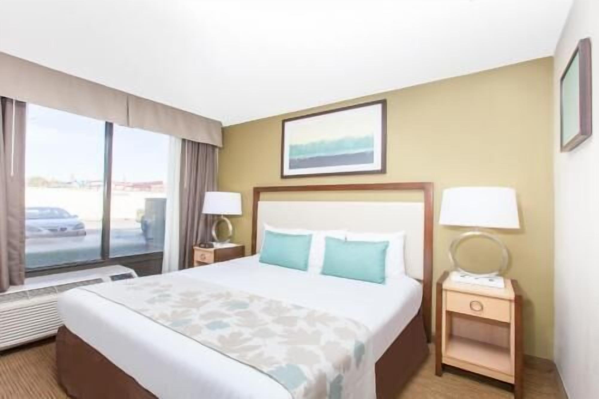 Premium bedding, desk, laptop workspace, blackout curtains