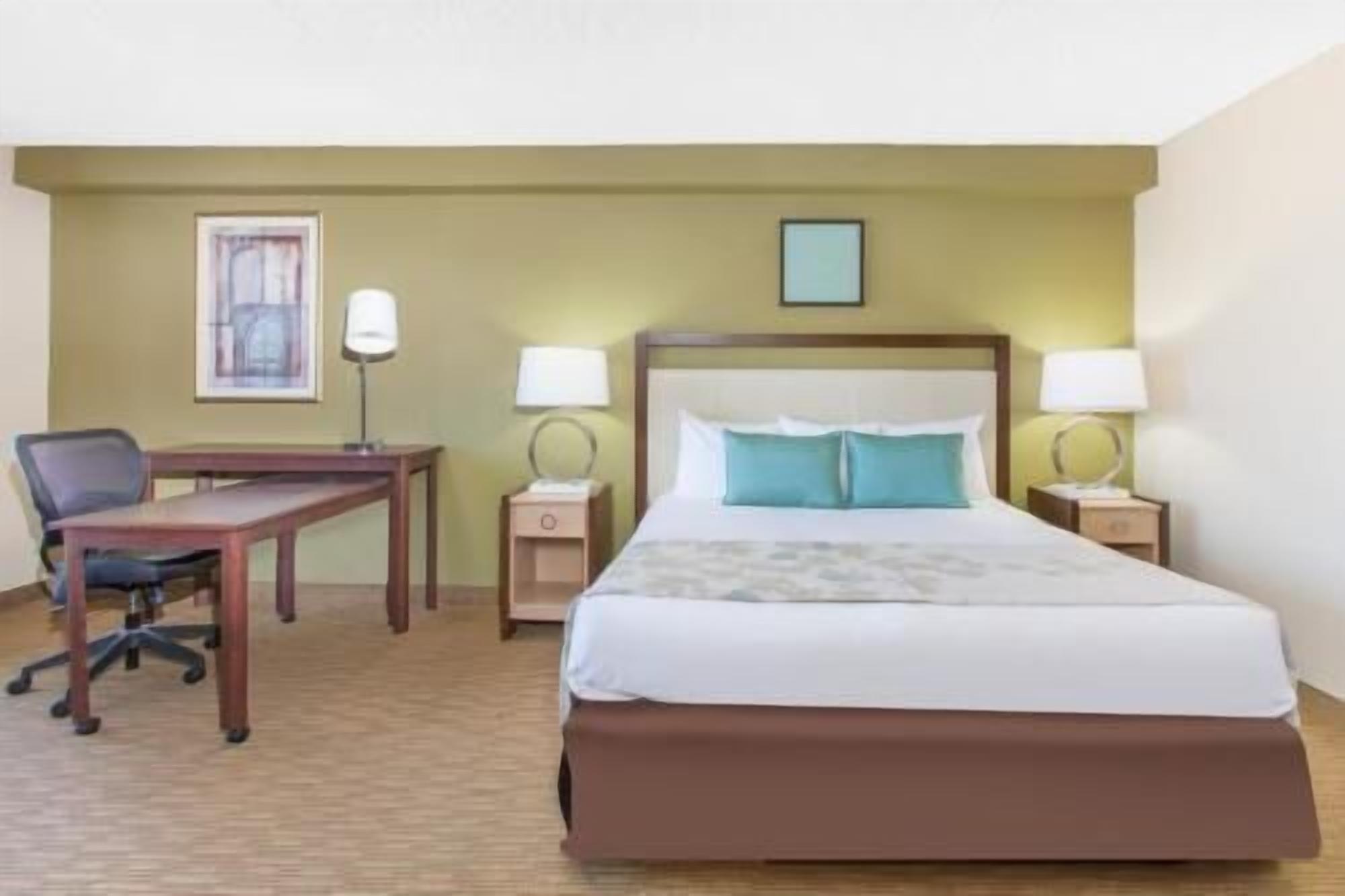 Premium bedding, desk, laptop workspace, blackout curtains