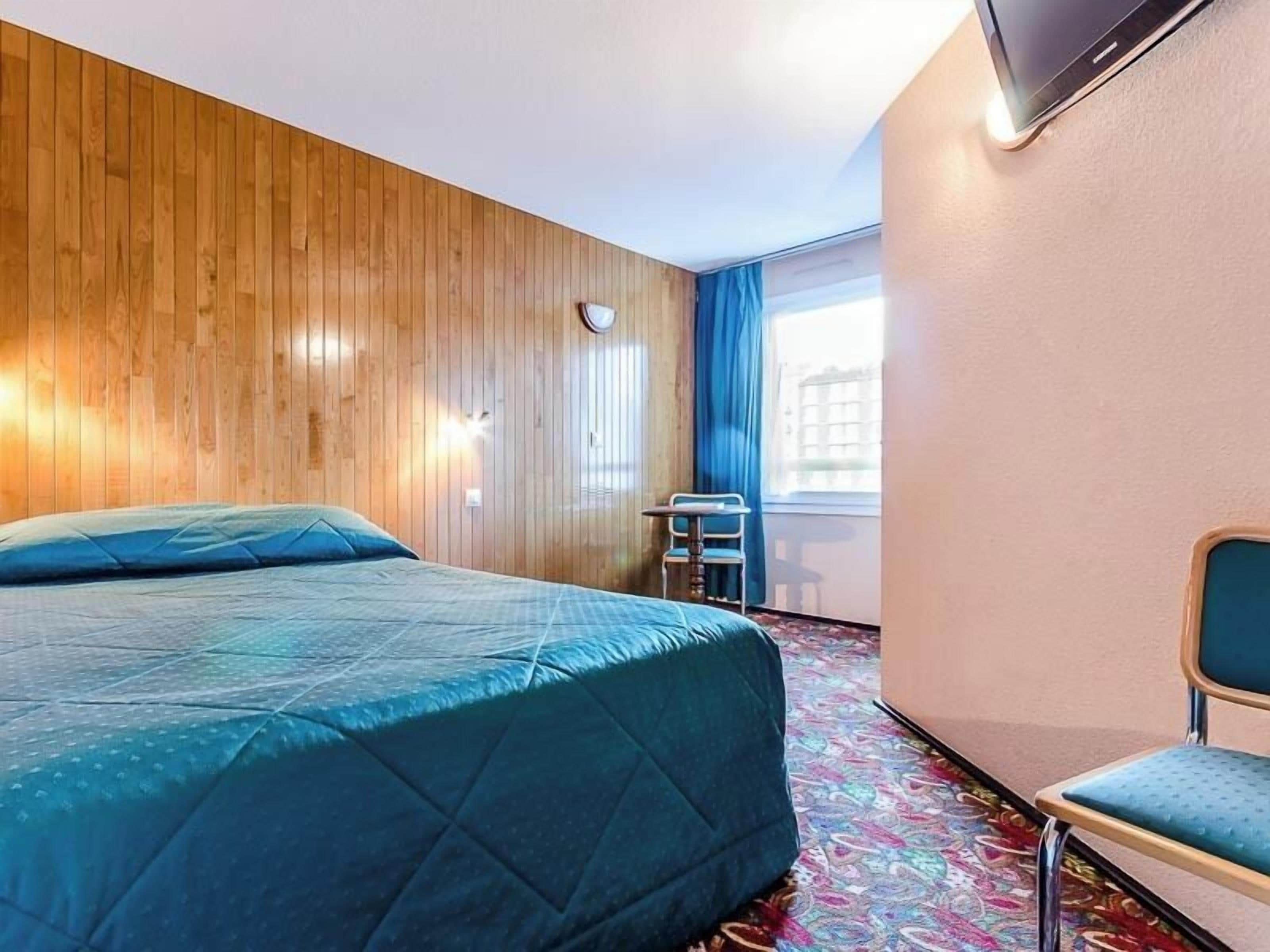 Desk, blackout curtains, iron/ironing board (on request)