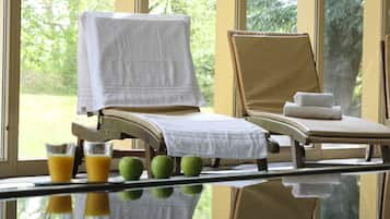 Indoor pool, open 7:00 AM to 9:00 PM, pool loungers