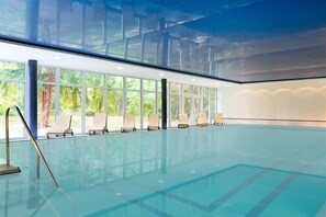Indoor pool, open 7:00 AM to 9:00 PM, pool loungers