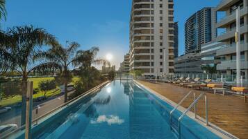 Outdoor pool, open 6:30 AM to 10:00 PM, free cabanas, pool umbrellas