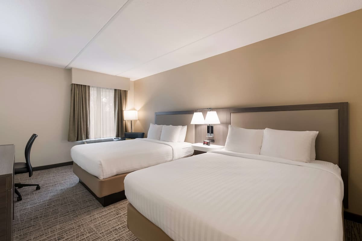 standard room, 2 queen beds, refrigerator & microwave, annex building | in-room safe, soundproofing, iron/ironing board, rollaway beds