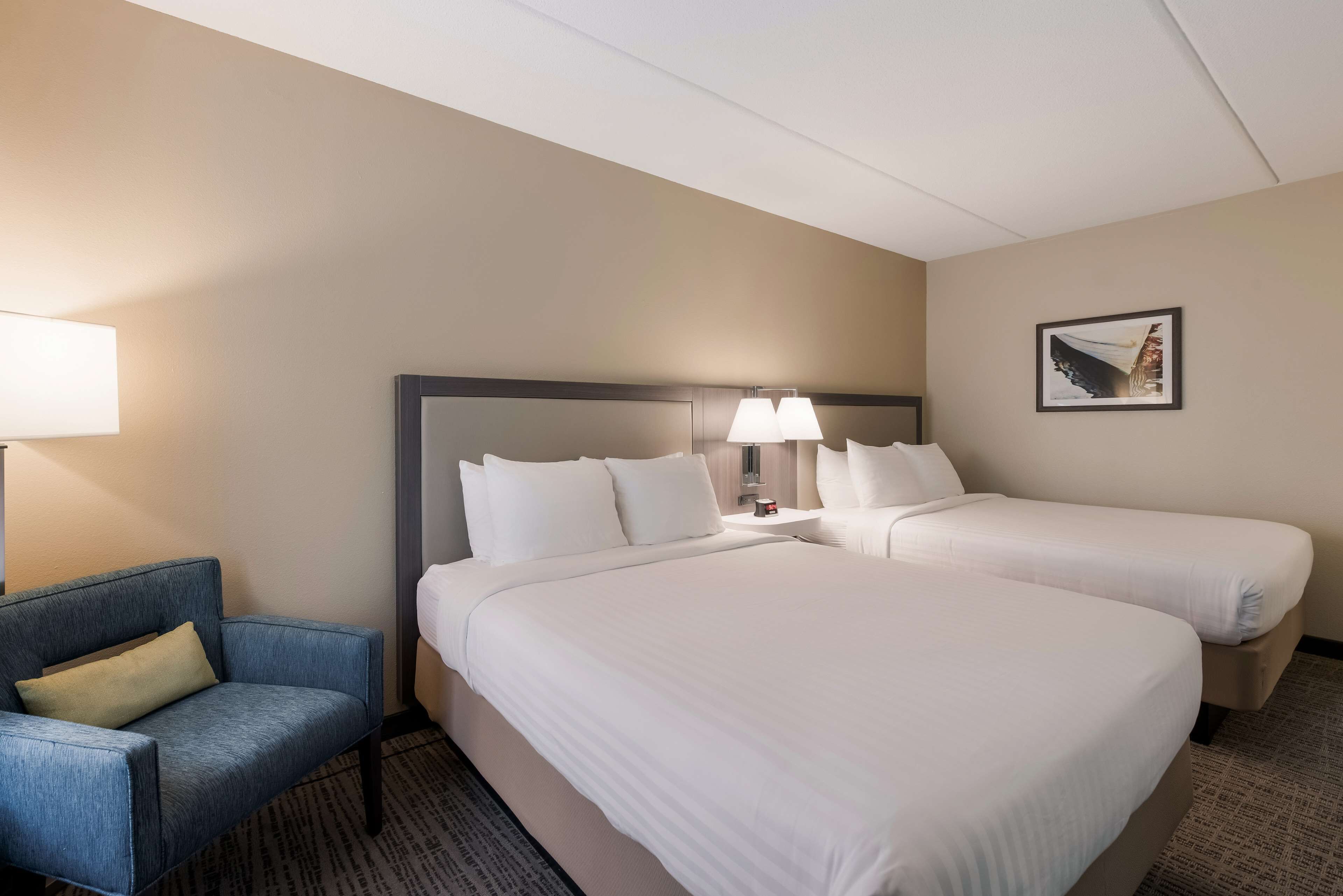 standard room, 2 queen beds, refrigerator & microwave, annex building | in-room safe, soundproofing, iron/ironing board, rollaway beds