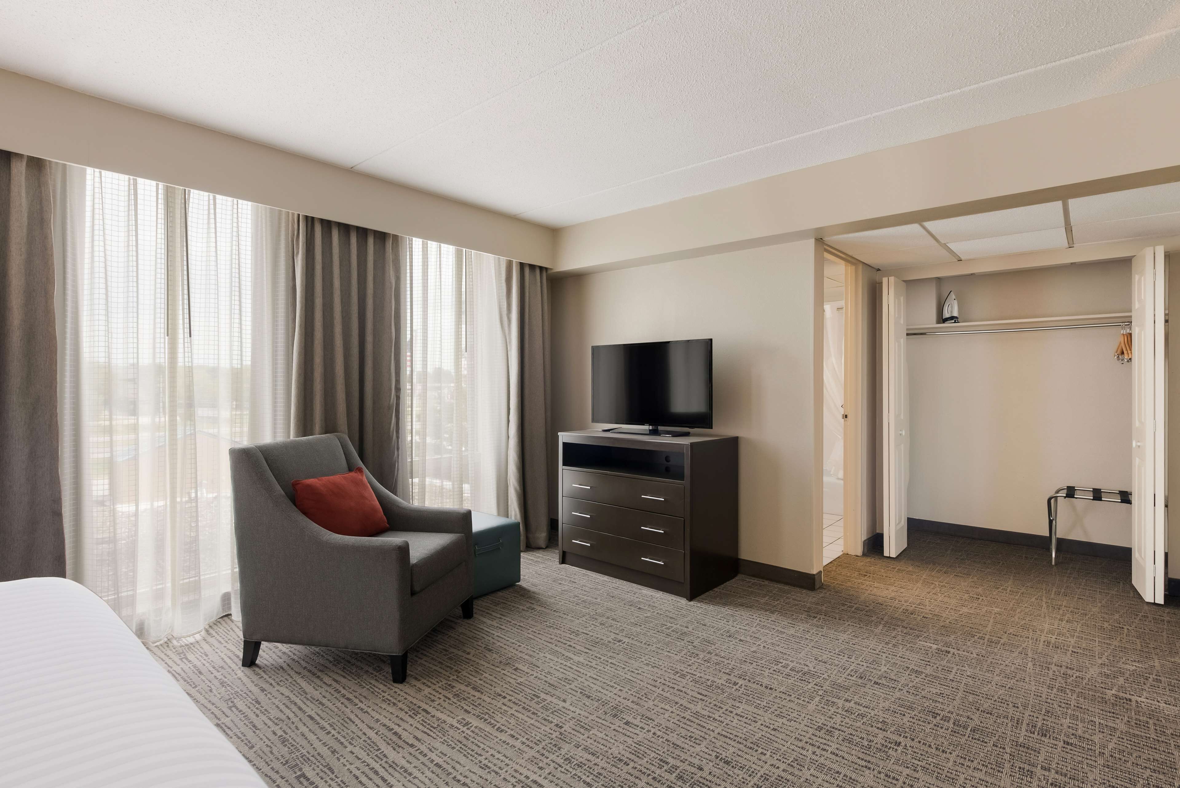 suite, 1 king bed, non smoking, refrigerator & microwave | in-room safe, soundproofing, iron/ironing board, rollaway beds
