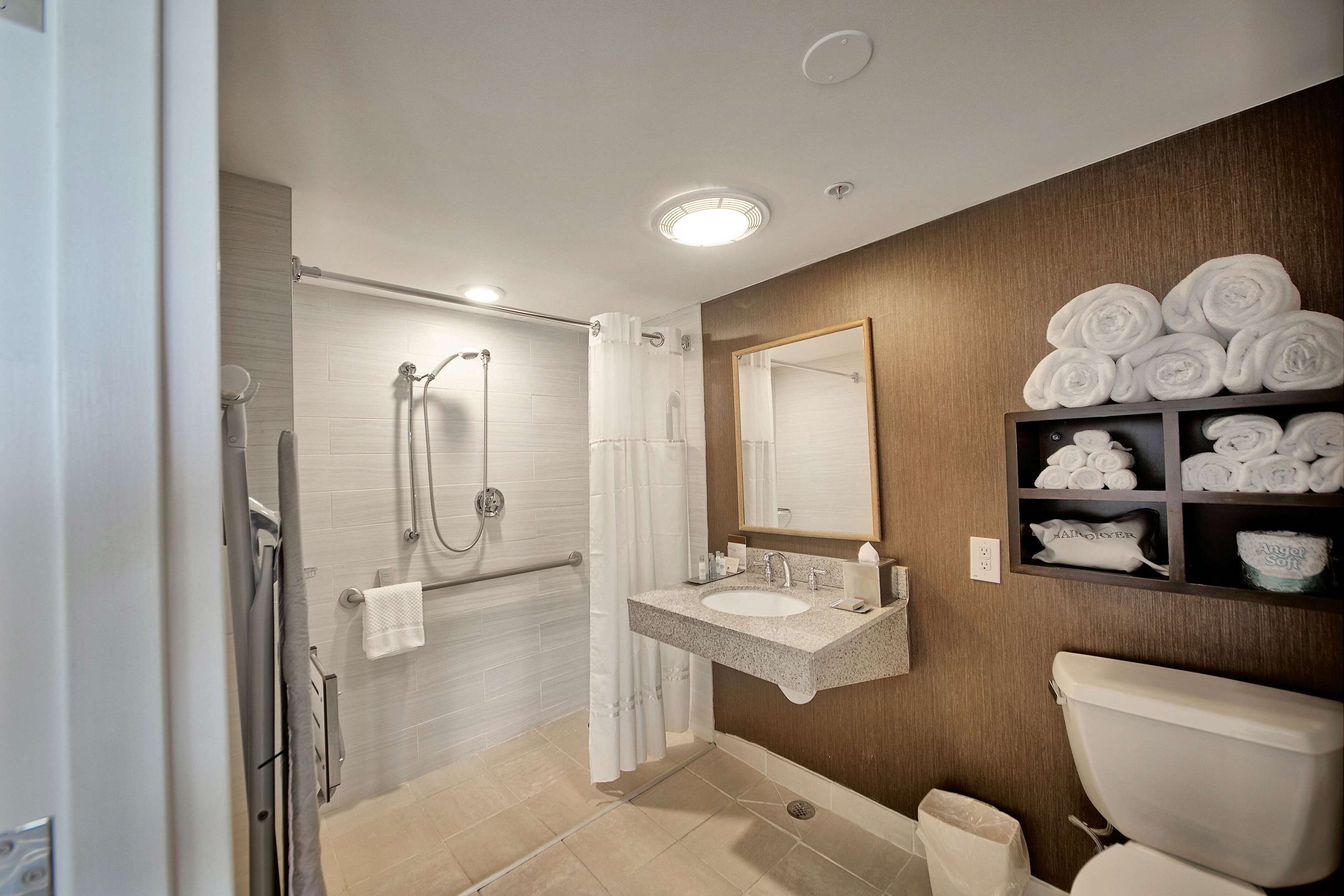 combined shower/bathtub, hair dryer, bathrobes, towels