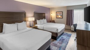 A hotel room with two beds, a desk, a chair, a TV, and a painting on the wall. - Best Western Hickory (Hickory)
