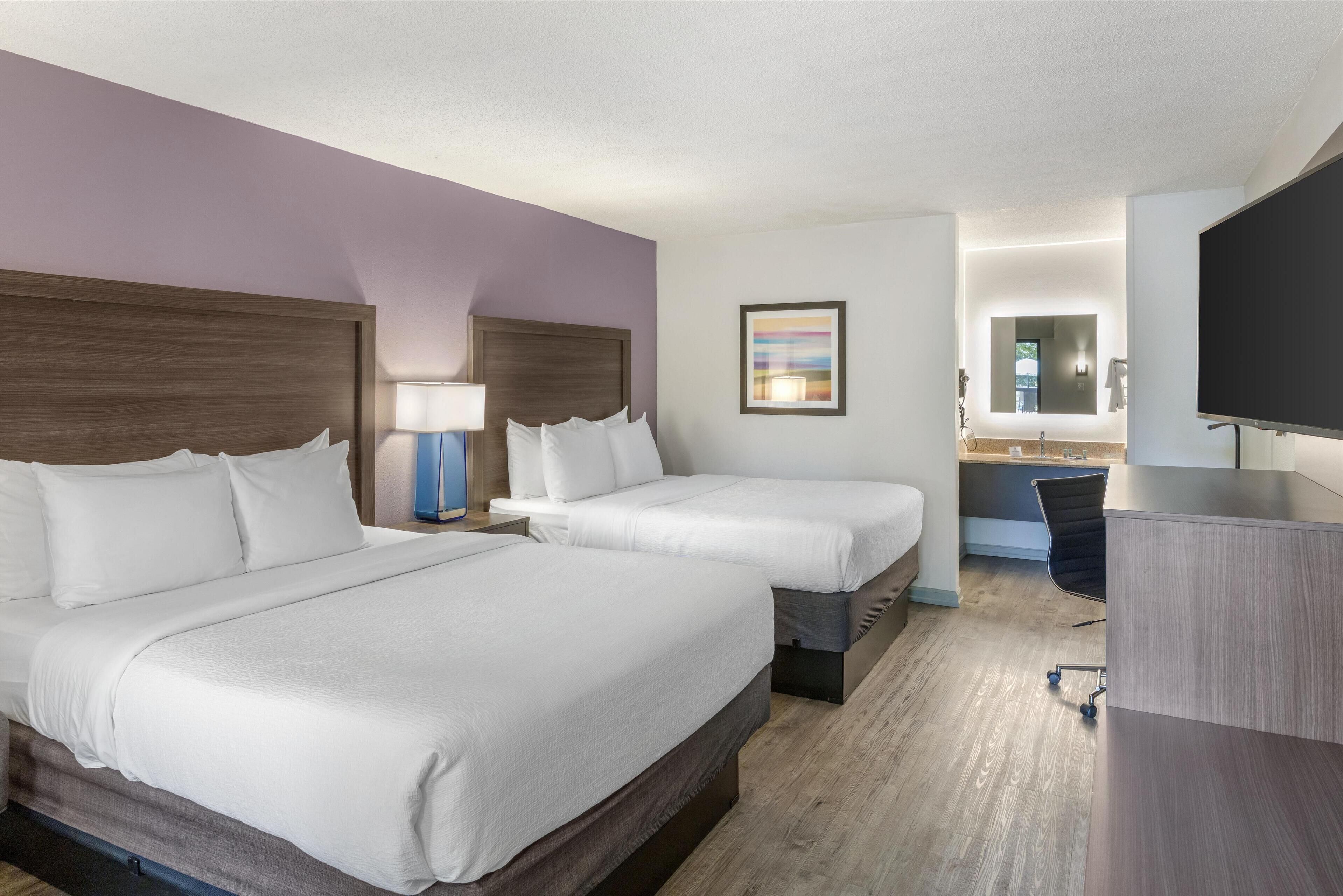 standard room, 2 queen beds, non smoking, refrigerator & microwave | 1 bedroom, in-room safe, desk, laptop workspace