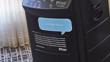 A black air purifier with a control panel and a speech bubble saying "Let's clean the air."