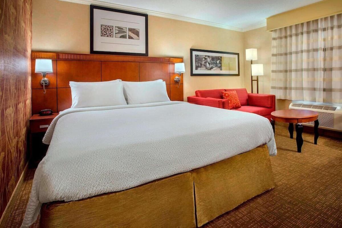Premium bedding, desk, laptop workspace, iron/ironing board
