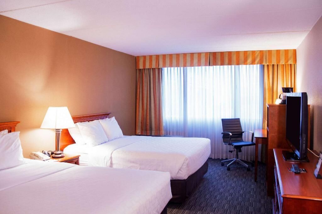 Desk, blackout drapes, iron/ironing board, free cribs/infant beds