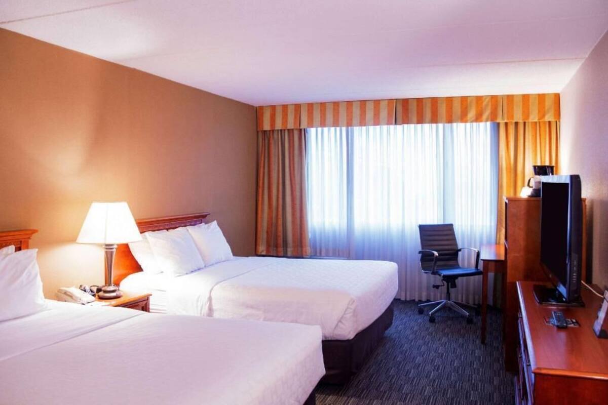 Desk, blackout drapes, iron/ironing board, free cribs/infant beds