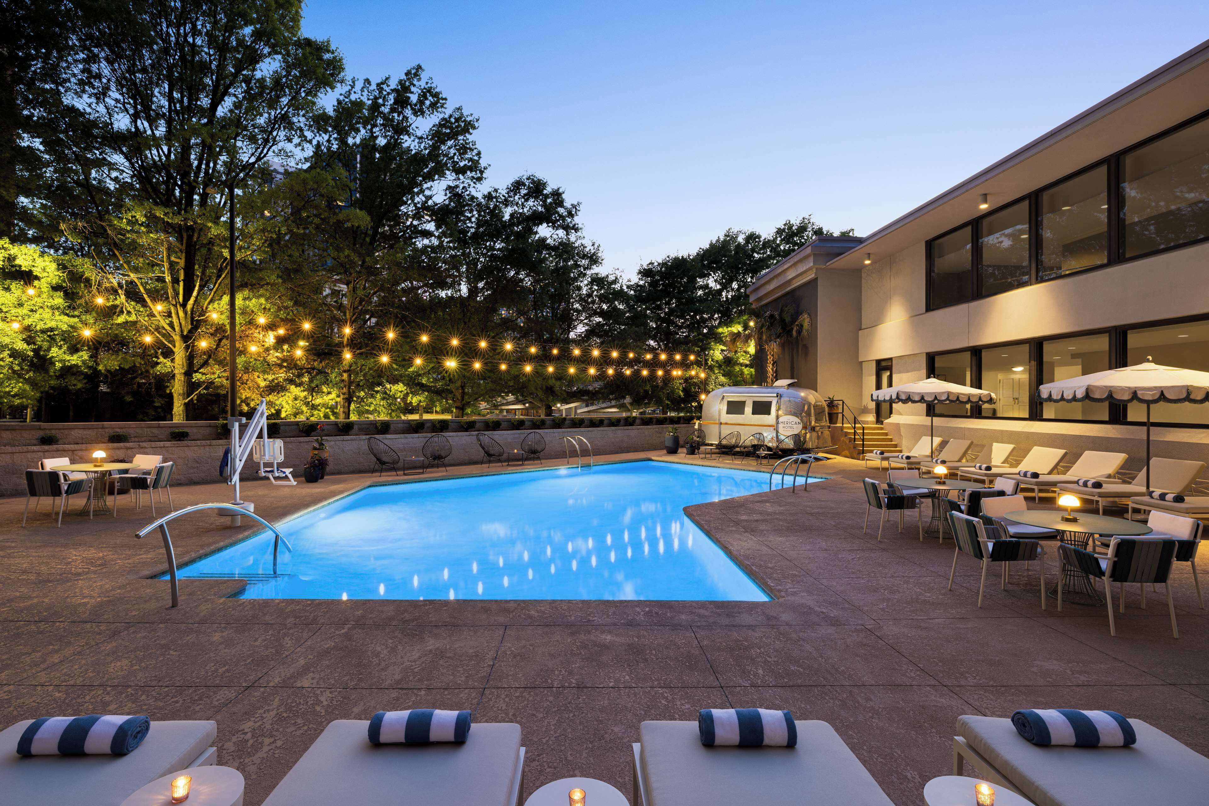 Seasonal outdoor pool, pool umbrellas, pool loungers