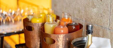 A bar area with copper drink dispensers and glasses.