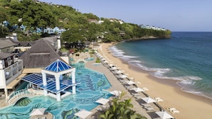 A resort with a swimming pool, beach, and ocean views. - Sandals Regency La Toc - ALL INCLUSIVE Adults Only (Castries)