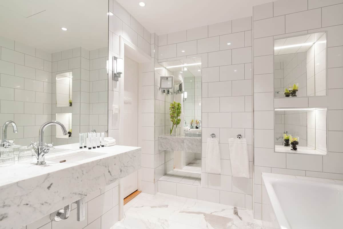 suite | bathroom | shower, hair dryer, towels