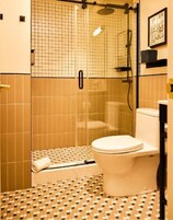 Shower, rainfall showerhead, designer toiletries, hair dryer