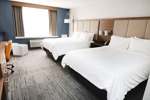 Premium bedding, desk, laptop workspace, blackout curtains