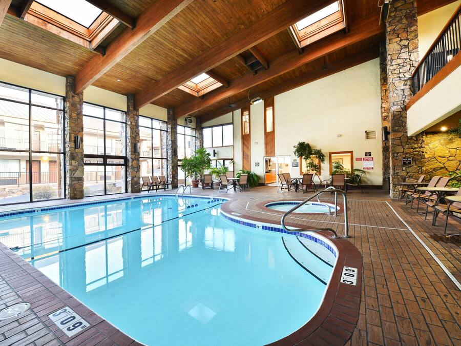 Indoor pool, outdoor pool, open 8 AM to midnight, pool loungers