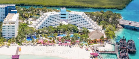 On the beach, white sand, beach umbrellas, beach towels