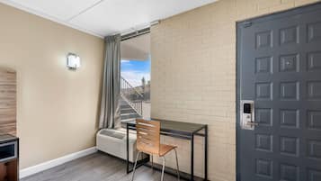 Down comforters, desk, blackout drapes, iron/ironing board