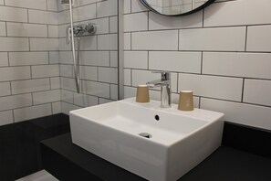 Eco-friendly toiletries, hair dryer, towels