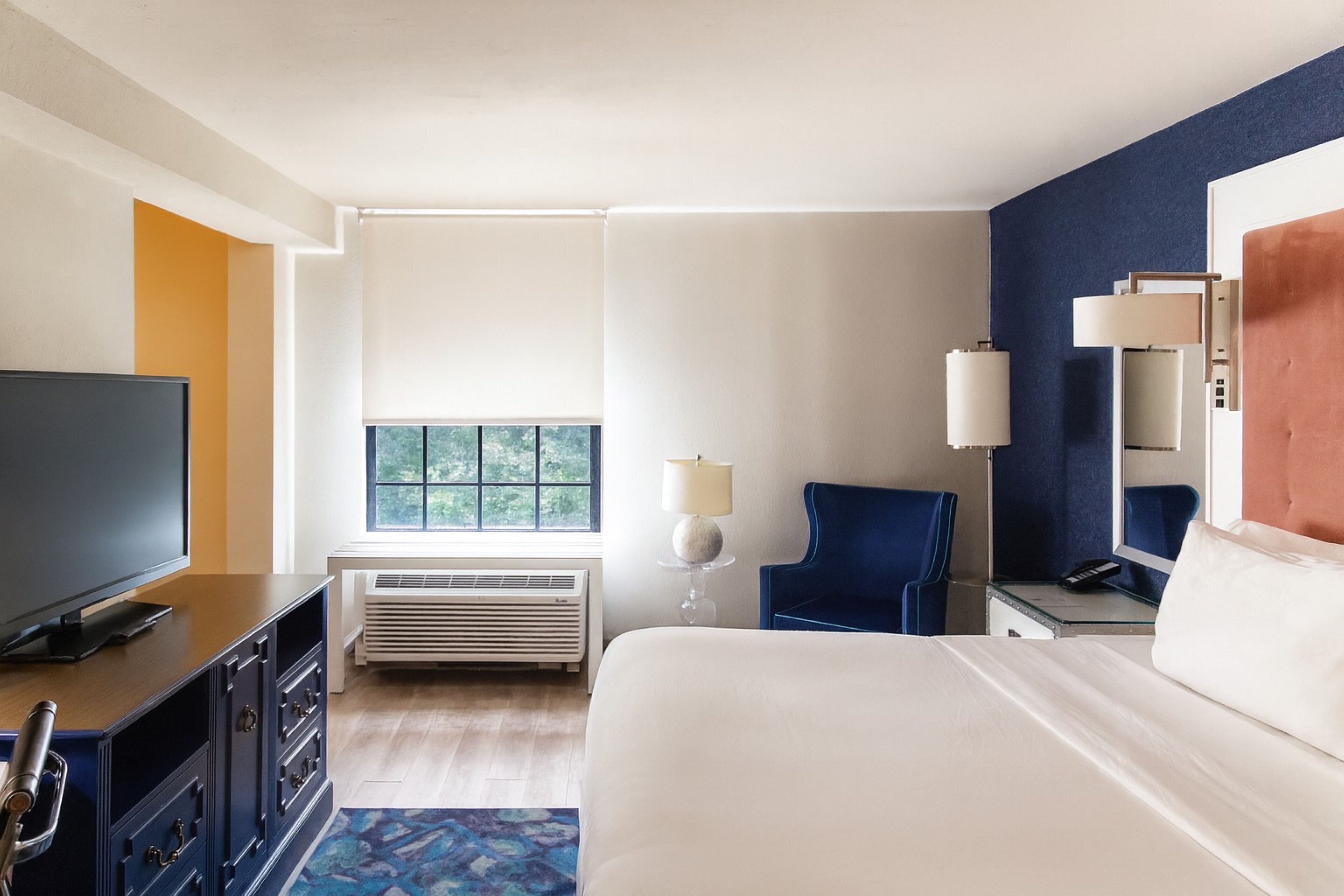 Desk, laptop workspace, blackout drapes, iron/ironing board