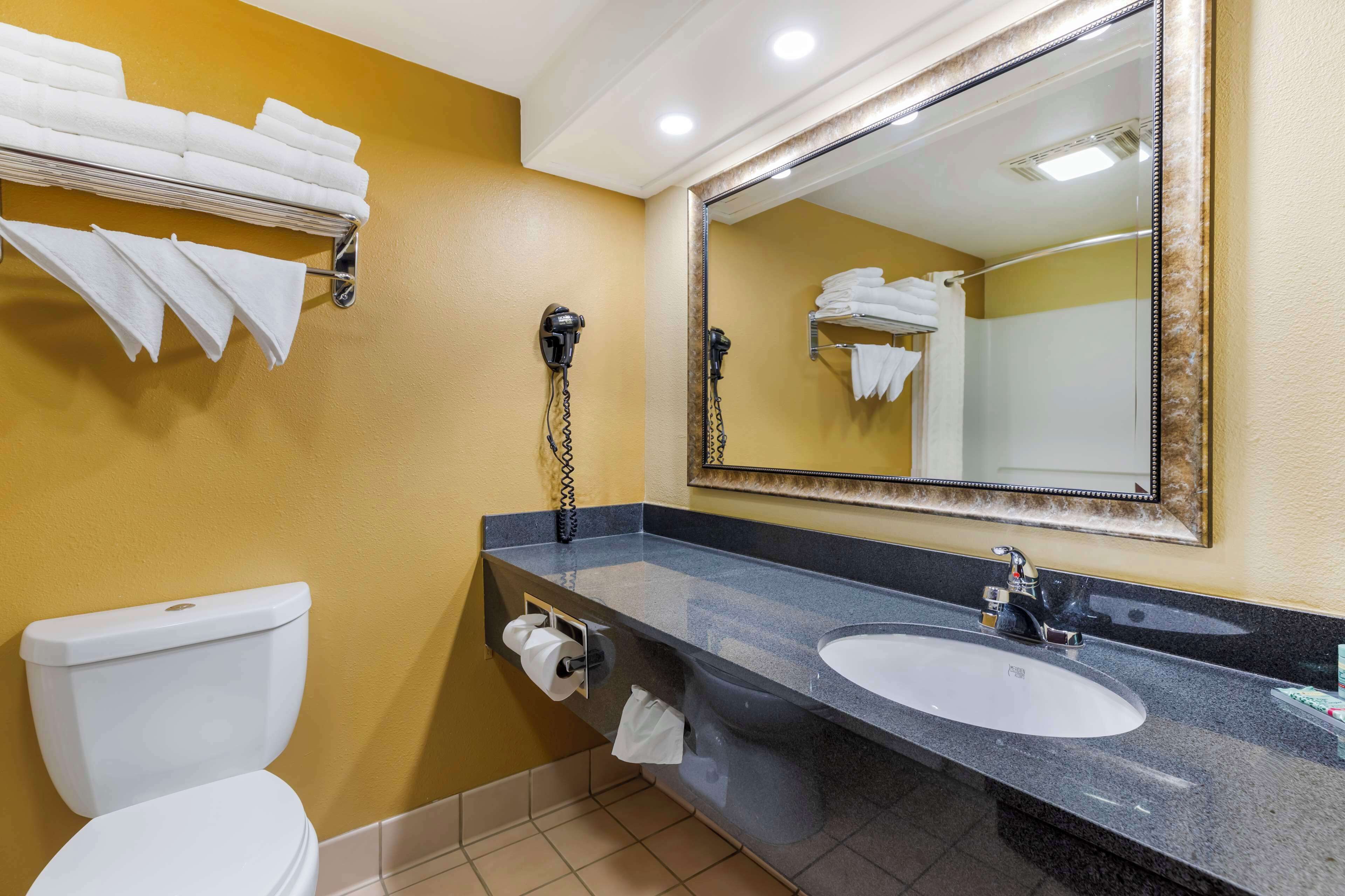 standard room, 2 queen beds, non smoking, refrigerator & microwave | bathroom | combined shower/bathtub, free toiletries, hair dryer, towels