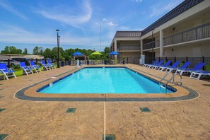 Seasonal outdoor pool, pool loungers