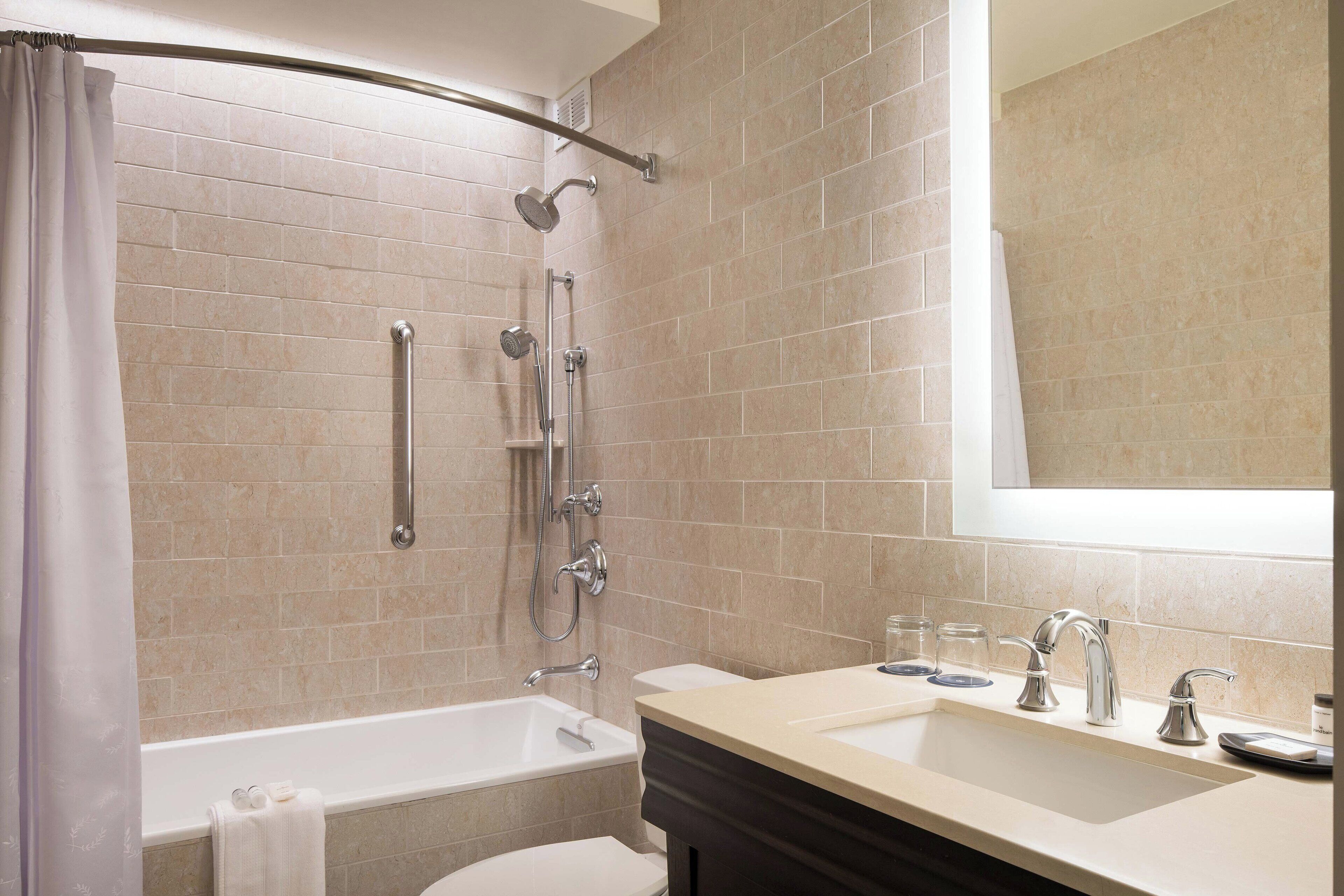 shower, designer toiletries, hair dryer, towels