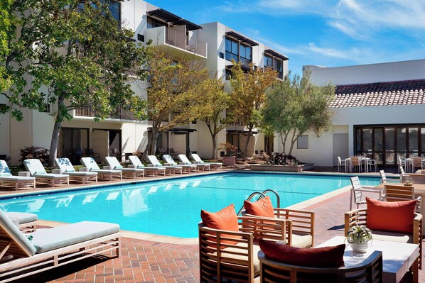 Outdoor pool, open 6 AM to 10:00 PM, pool umbrellas, pool loungers