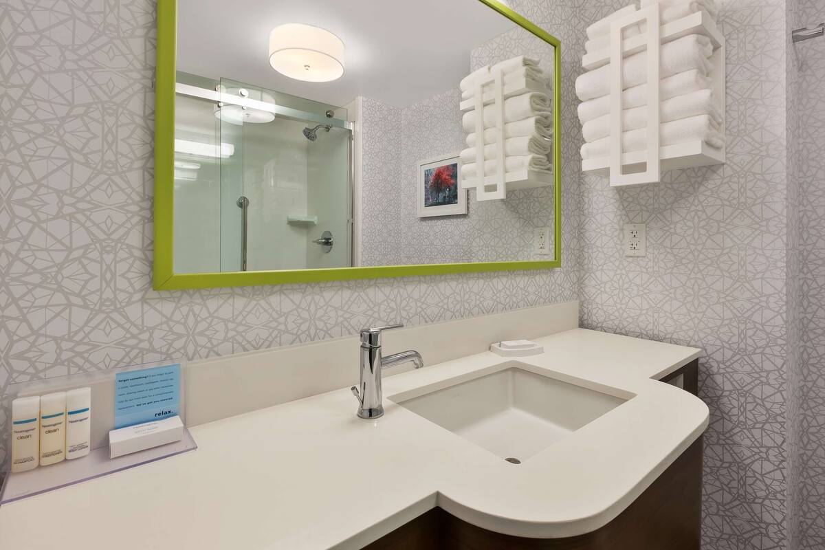 eco-friendly toiletries, hair dryer, towels