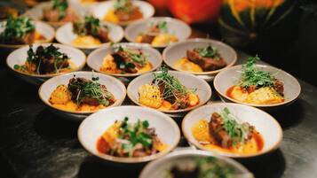 A series of small, round dishes arranged on a table.