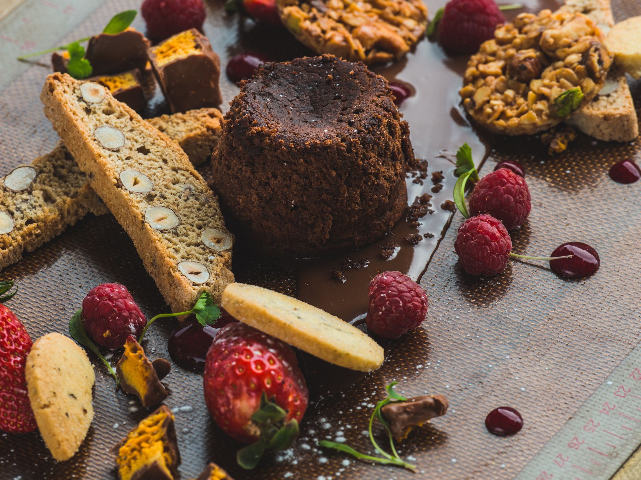 A dessert platter with various sweets and fruits.