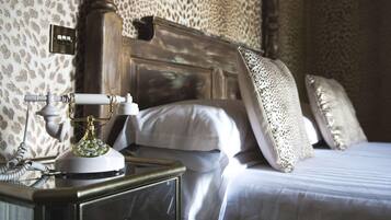 Premium bedding, desk, laptop workspace, iron/ironing board